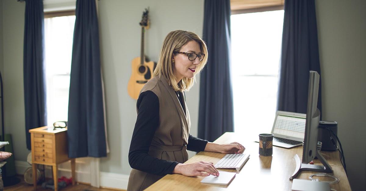 Remote Executive Assistant working at computer