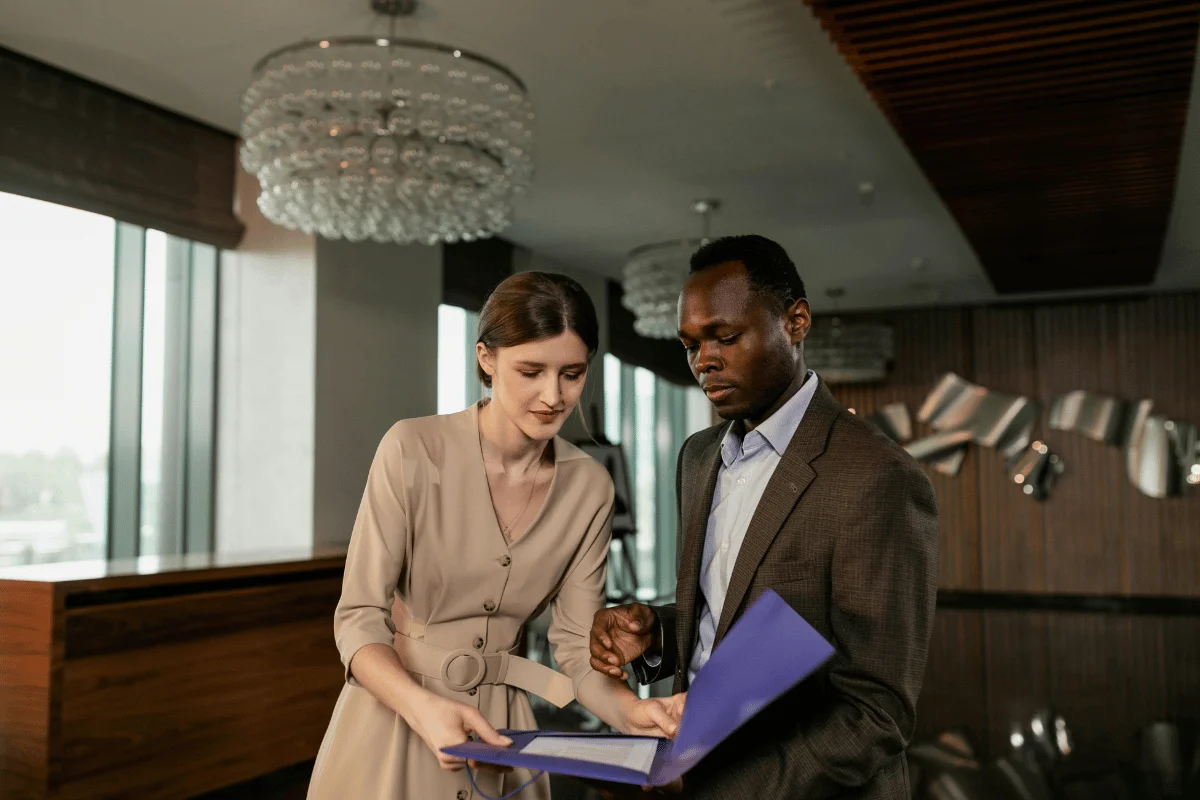 Business professionals reviewing documents in a modern office.