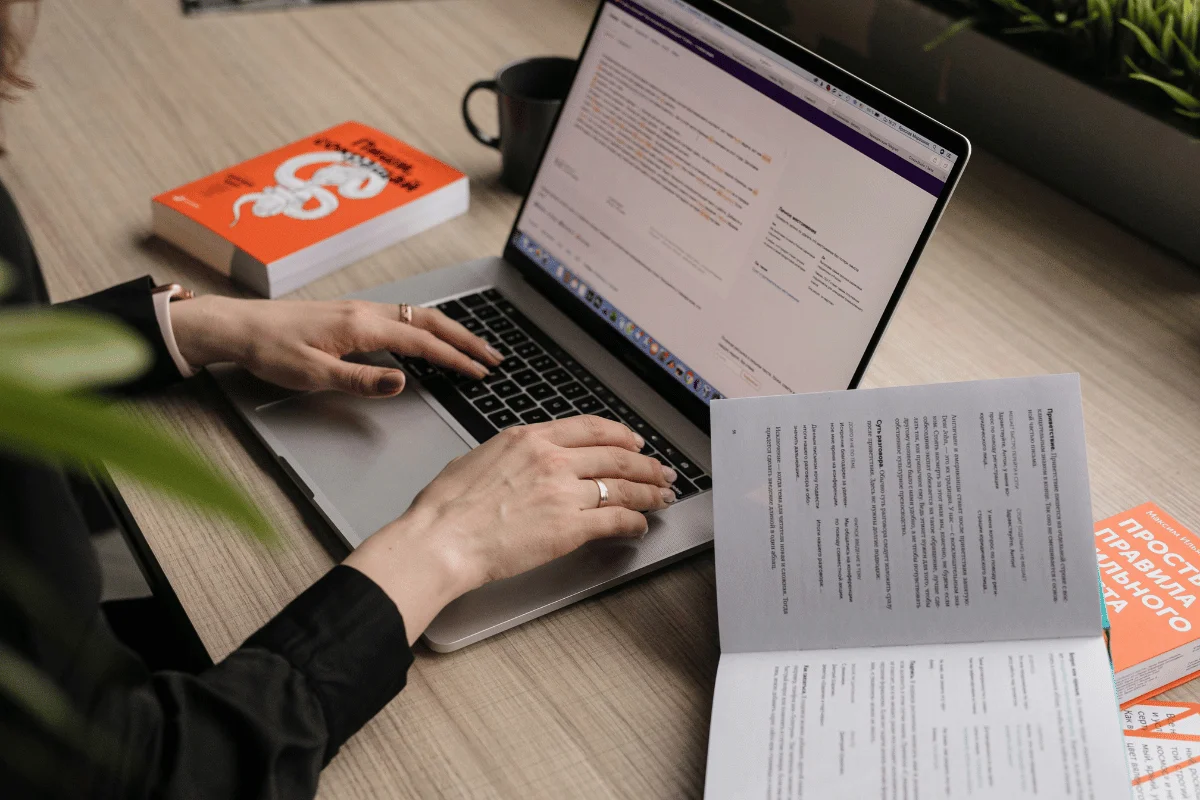 Focused businesswoman reviewing documents at her desk.