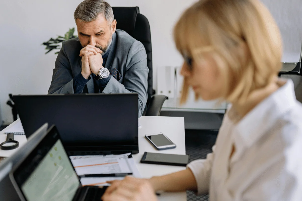Businessman in deep thought while working at his office desk.