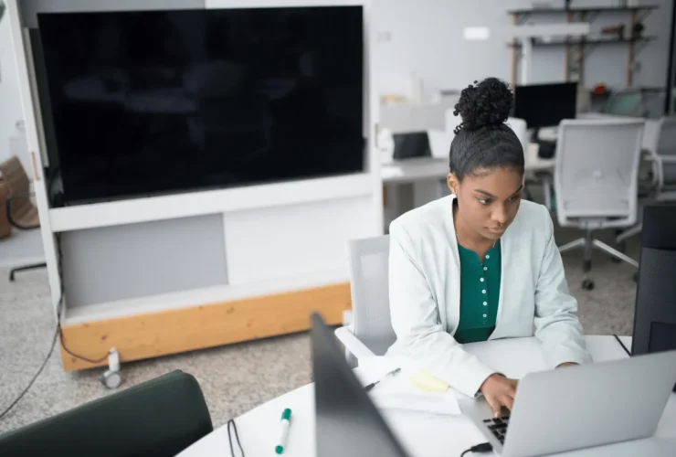 Virtual assistant managing business tasks at her desk.