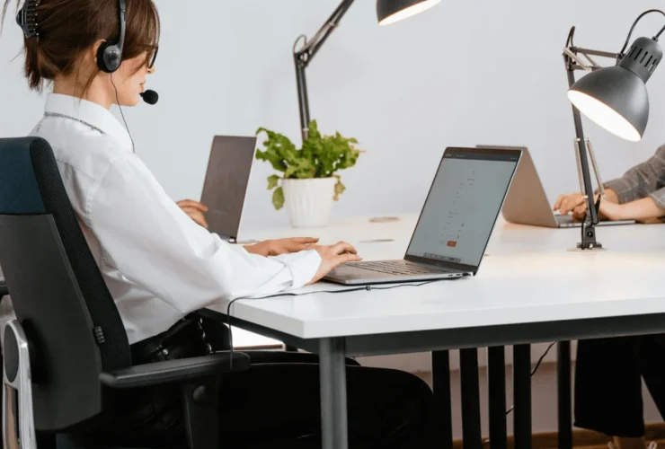Office setup with bright lighting and desk lamps.