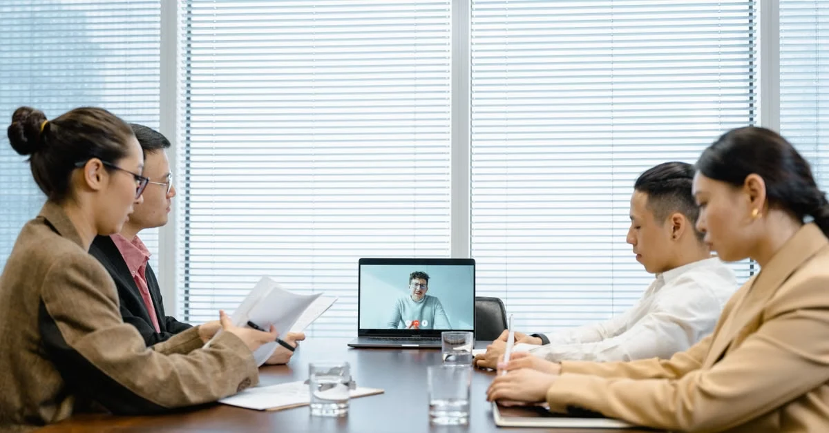 Executive assistant sales leaders join video conference with remote team members discussing pipeline review strategy.